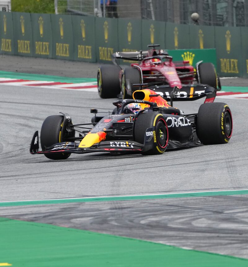 Red Bull's Max Verstappen followed by Ferrari driver Charles Leclerc. AP