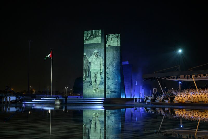 An image of the late President Sheikh Khalifa is projected on to the monument at Wahat Al Karama during the Commemoration Day ceremony.

