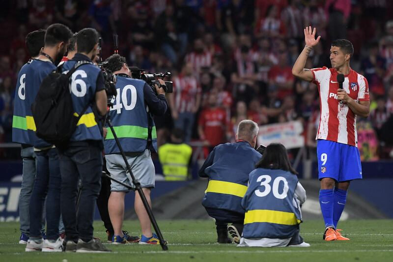 Luis Suarez waves and addresses the crowd during his farewell as an Atletico Madrid player. AFP