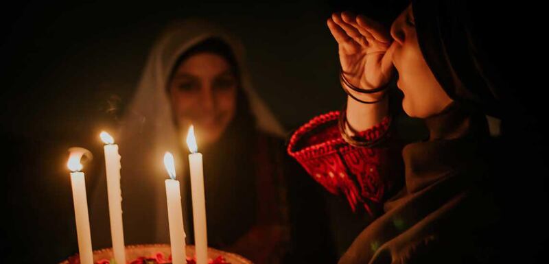 FATIMA SHBAIR PALESTINIAN WEDDING - HENNA NIGHT GAZA PALESTINE
"Henna Night in villages is the most important night for the bride, it precedes the wedding night by a day or two. Its an old Palestinian custom in which relatives and friends of the bride gather to celebrate her, say goodbye to her as it's her last night in her father's house and sing sad folk songs called (Al-Tarwida), which depicts the bride clings to her family and friends. In this night, many brides wear the traditional costume, which is, according to the Palestinian heritage, the embroidered Palestinian dress. These pictures show joy and celebration moments of the bride that starts from preparing her for this night to the moments of bringing the candles-decorated henna that represent a Palestinian tradition and the final moments of celebrations full of dancing and singing. Credit: National Geographic. 