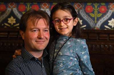 (FILES) In this file photo taken on October 11, 2019 Richard Ratcliffe, husband of British-Iranian aid worker Nazanin Zaghari-Ratcliffe jailed in Tehran since 2016, holds his daughter Gabriella during a news conference in London, on October 11, 2019. The release of Nazanin Zaghari-Ratcliffe, a UK-Iraninan dual national held in Tehran, could be in doubt, her husband Richard Ratcliffe told the BBC on March 6, 2021, a day before the end of her five-year jail term. Zaghari-Ratcliffe, who was detained in Iran in 2016, is due to be released on March 7, 2021, the official end of a sentence over charges she plotted to overthrow the regime in Tehran. Nazanin, now 42, has strenuously denied the accusations with her case becoming a matter of major diplomatic disagreement between Britain and Iran during the five years she has spent separated from her husband and young daughter.

 / AFP / DANIEL LEAL-OLIVAS
