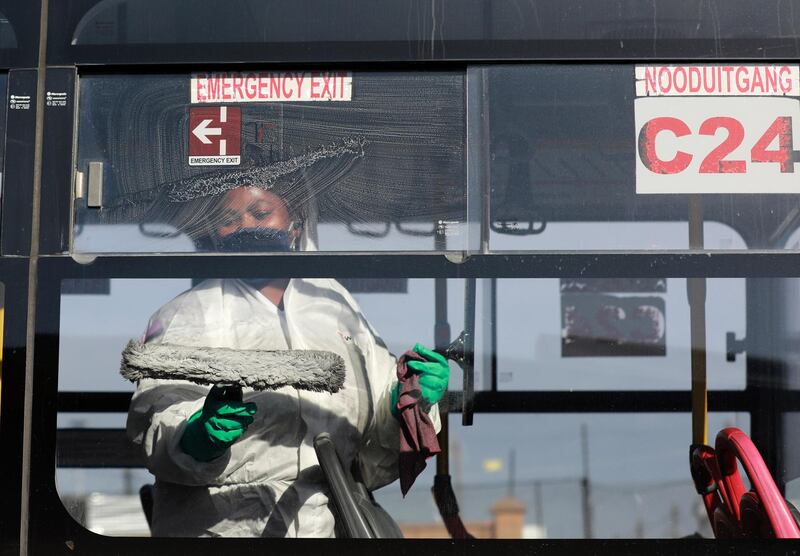 A public bus is sanitised after the morning peak period in Cape Town, South Africa, Friday, May 22, 2020. With dramatically increased community transmissions, Cape Town has become the centre of the coronavirus outbreak in South Africa. (AP Photo/Nardus Engelbrecht)