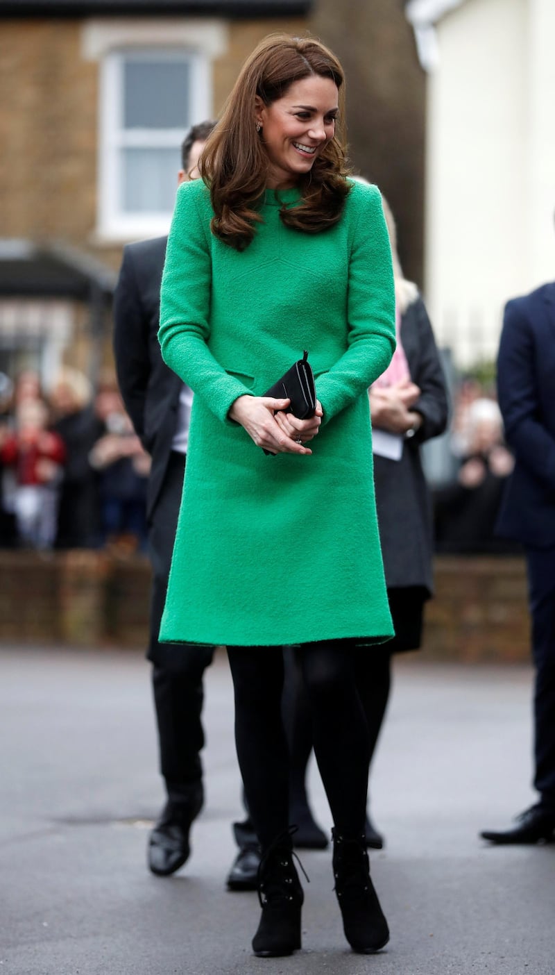 The Duchess of Cambridge wears a green dress by Eponine London as she arrives at Lavender Primary School in support of Place2Be Children's Mental Health Week 2019 on February 5. The look is completed with black tights, LK Bennett boots, a Mulberry Bayswater clutch and Kiki McDonough earrings. Reuters