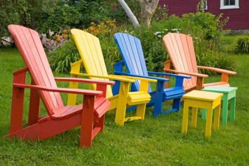 Multi-colored Adirondack chairs in the summer garden. (iStockphoto.com)