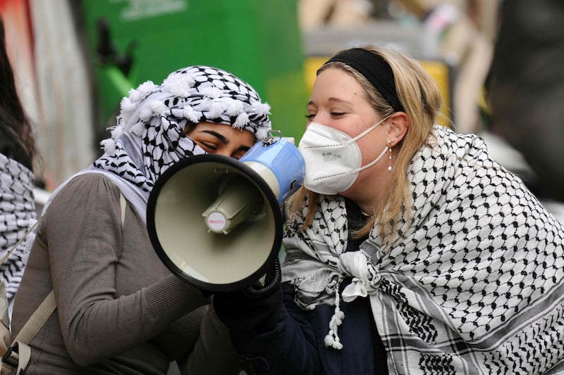 Demonstrators speak into a megaphone during the occupation. AFP