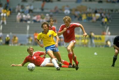 Zico, left, sports Brazil's kit in the 1986 World Cup in Mexico City. Mike King / Allsport / Getty Images 