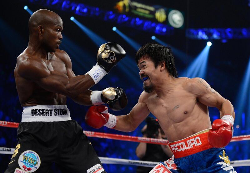 LAS VEGAS, NV - JUNE 09:  (R-L) Manny Pacquiao prepares to throw a left to the head of Timothy Bradley during their WBO welterweight title fight at MGM Grand Garden Arena on June 9, 2012 in Las Vegas, Nevada.  (Photo by Kevork Djansezian/Getty Images)