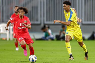 Gharafa's defender Homam Ahmed (R) vies for the ball against Shabab's midfielder Omar Abdulrahman (L) during the AFC Champions League group C match between UAE's Shabab al-Ahli and Qatar's al-Gharafa at Prince Abdullah Al Faisal Stadium in Saudi Arabia's Jeddah on April 14, 2022. (Photo by AFP)