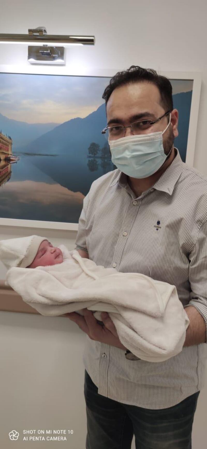 UAE 2021 baby born on the stroke of midnight with father Yasser Khan. Courtesy: Aster Hospital Quisais. 