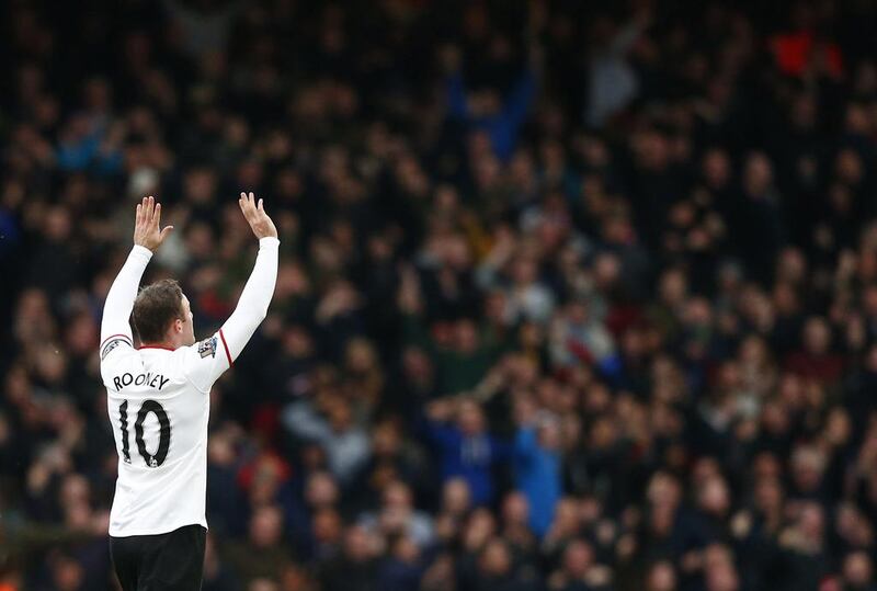 Wayne Rooney acknowledges the crowd after scoring on Saturday. Andrew Winning / Reuters  / March 22, 2014