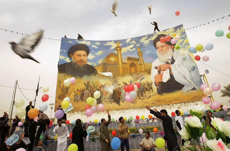 Balloons fly as Iraqi Shiite Muslims free pigeons while holding signs reading in Arabic "We are coming" during the inauguration ceremony of a renovated mural bearing the portraits of Shiite clerics Mohammed Baqer al-Sadr (L) and Mohammed Sadeq al-Sadr (R) following Friday prayers in Baghdad's Shiite bastion of Sadr City on March 5, 2010. Politicians launched into their last day of campaigning as more than a million Iraqis living abroad began voting in an election that could turn the page on years of deadly sectarian strife. AFP PHOTO/JOSEPH EID / AFP PHOTO / JOSEPH EID