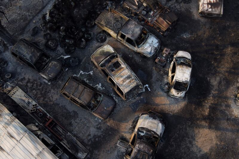 Gutted vehicles at a body shop, after the property was burnt by the Smokehouse Creek fire, in Canadian, Texas. AP