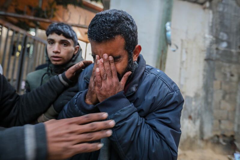 People mourn as they collect the bodies of friends and relatives killed in in Rafah, Gaza. Getty Images