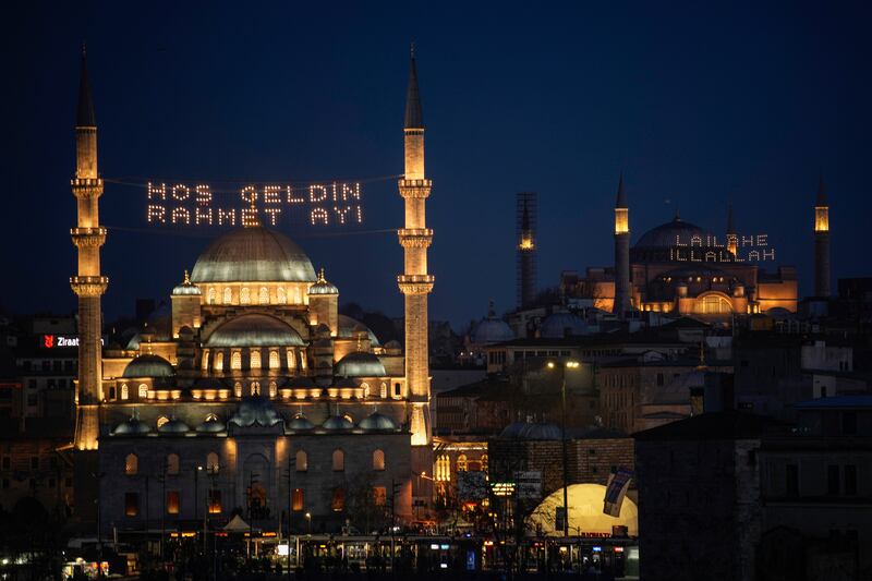 New Valide Sultan Mosque, left, and Hagia Sophia Mosque in Istanbul welcome worshippers on the eve of Ramadan. AP