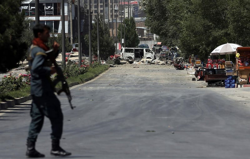 A security forces soldier arrives at the site of an explosion in Kabul, Afghanistan, Monday, July 1, 2019. A powerful bomb blast rocked the Afghan capital early Monday, rattling windows, sending smoke billowing from Kabul's downtown area and wounding dozens of people, including nine children hurt by flying glass, officials and a medic said. (AP Photo/Rahmat Gul)