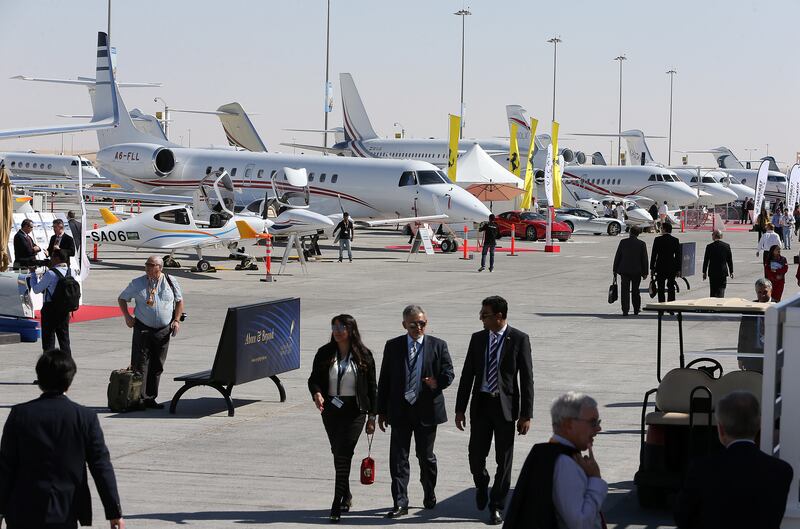 
DUBAI , UNITED ARAB EMIRATES Ð Dec 8 , 2014 : Visitors at the Middle East Business Aviation air show held at Dubai World Central in Dubai. ( Pawan Singh / The National ) For Business. Story by Shereen Elgazzar