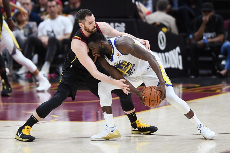 Cleveland Cavaliers center Kevin Love pressures Golden State Warriors forward Draymond Green. Ken Blaze / Reuters