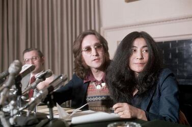 (Original Caption) 4/2/1973- New York, NY: John Lennon, a former "Beatle" with wife, Yoko Ono, during a press conference. Slide shows a waist up of the couple looking to the right. Getty Images