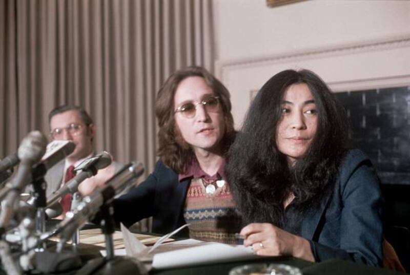 (Original Caption) 4/2/1973- New York, NY: John Lennon, a former "Beatle" with wife, Yoko Ono, during a press conference. Slide shows a waist up of the couple looking to the right.