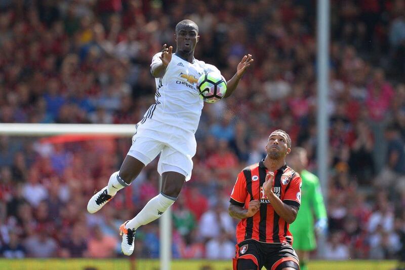 Manchester United defender Eric Bailly (L) leaps to control the ball next to Bournemouth striker Callum Wilson (R) during the Premier League football match between Bournemouth and Manchester United at the Vitality Stadium in Bournemouth, southern England on August 14, 2016. Glyn Kirk / AFP