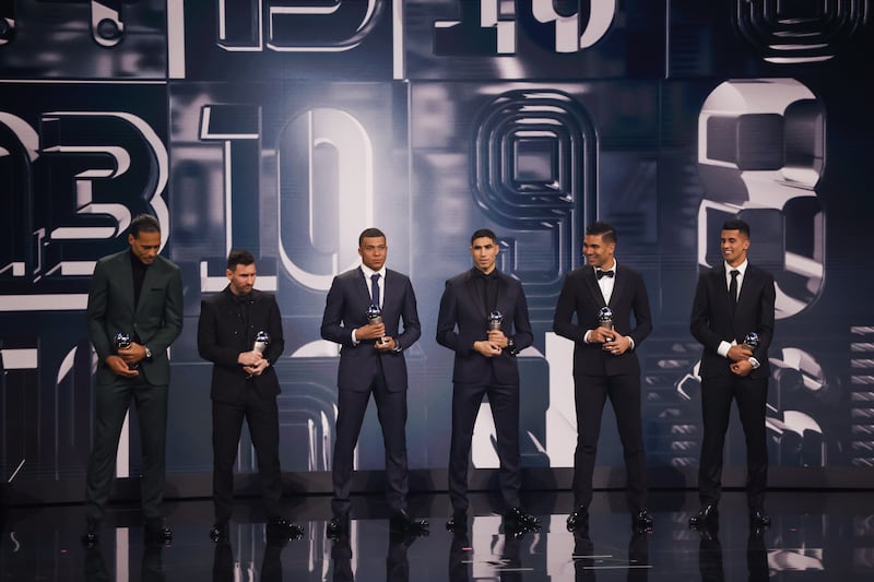 Virgil van Dijk of Liverpool, Lionel Messi, Kylian Mbappe and Achraf Hakimi of Paris Saint-Germain, Casemiro of Manchester United and Yassine Bounou of Sevilla with their Fifa Fifpro Men's World 11 Award on stage. EPA