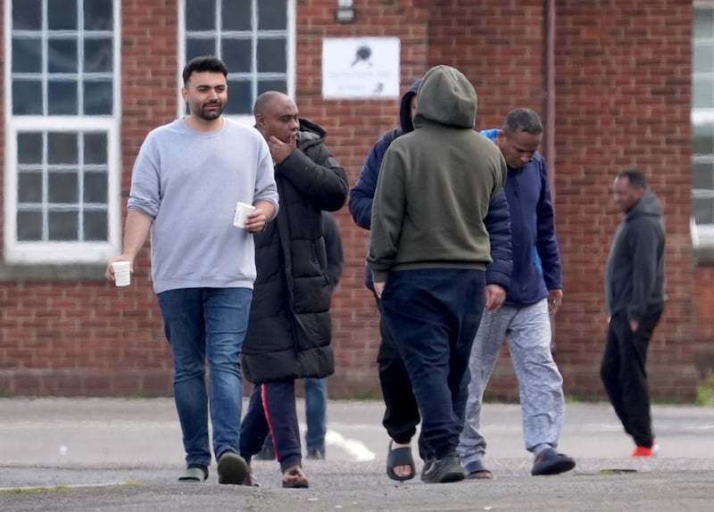 People thought to be migrants housed at Napier Barracks in Folkestone, Kent. PA