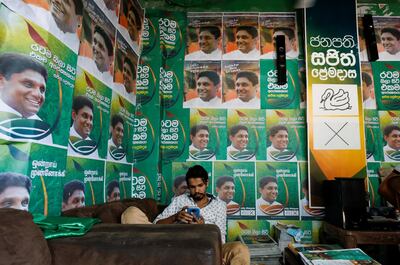 A supporter of Sajith Premadasa, Sri Lanka's presidential, candidate of the New Democratic Front alliance, sits inside a campaign office, in Colombo, Sri Lanka November 13, 2019. REUTERS/Dinuka Liyanawatte