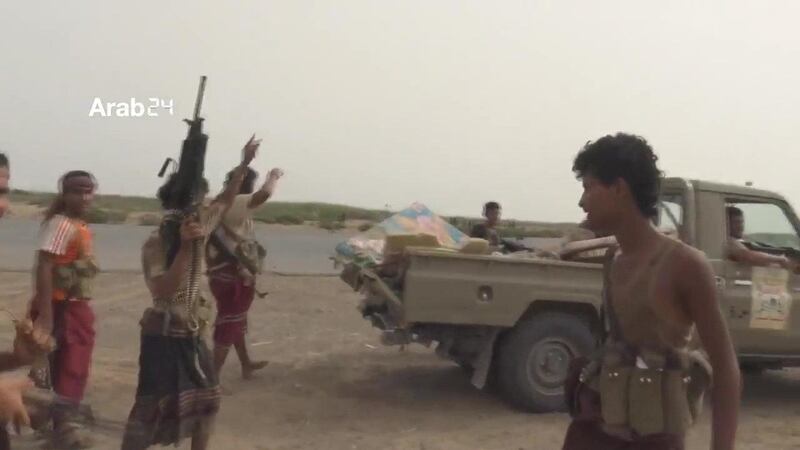Yemeni forces are seen near the airport on the outskirts of Hodeidah, Yemen, on June 20, 2018 in this still image taken from video. ARAB 24 via Reuters