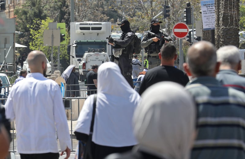 Palestinians return from Al Aqsa Mosque after Friday prayers. AFP