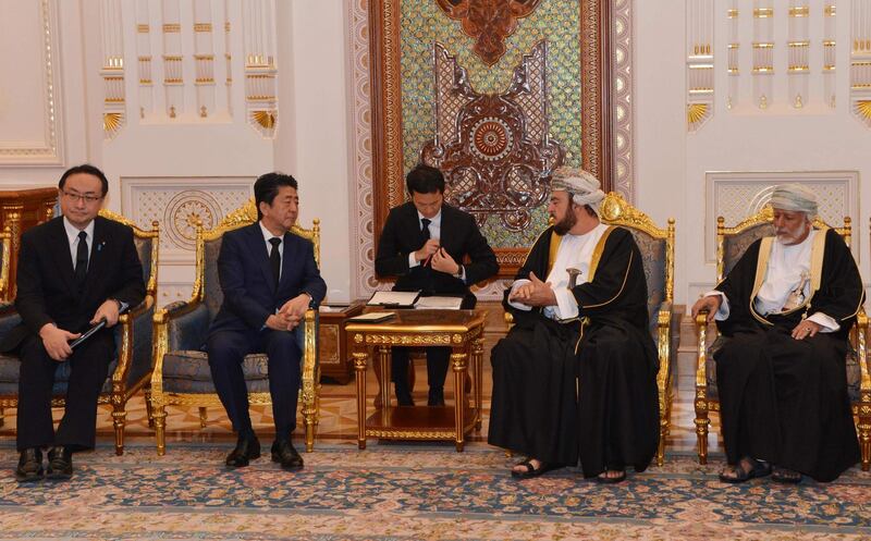 Japan's Prime Minister Shinzo Abe is received by Asaad bin Tariq, brother of Oman's new leader Sultan Haitham, alongside Oman's Minister of State for Foreign affairs Yusuf bin Alawi, second right, in Muscat  AFP