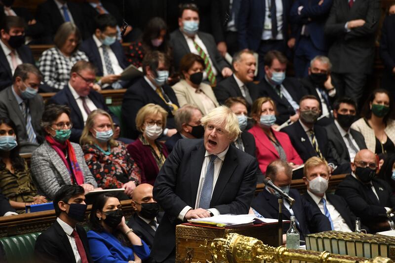 Mr Johnson speaks during Prime Minister's Questions in the House of Commons on December 8. Johnson apologised and announced an internal probe after a video emerged of senior aides joking about a Christmas party at Downing Street last year. AFP
