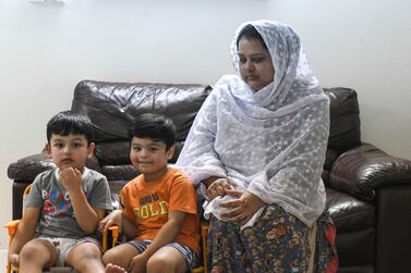 Mahjbeen Ahmed, Mr Ali's wife, with their two sons, Ariz, 3, and Abban, 4 at their home in Al Bahya. Khushnum Bhandari for The National