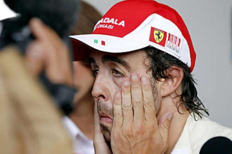 Fernando Alonso grimaces after finishing 12th.