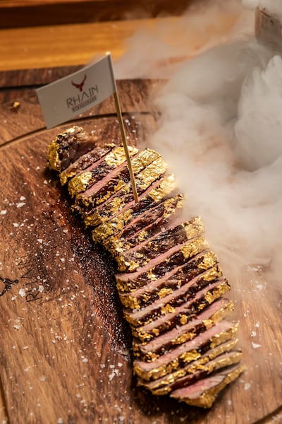 A gold-covered steak from the new Rhain Steakhouse restaurant in Dubai. Photo: Antonie Robertson / The National

