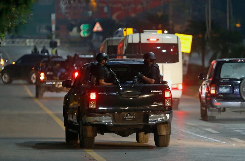 A special unit of Pakistani security forces escorts the Australian team to their hotel upon arrival in Islamabad. AP