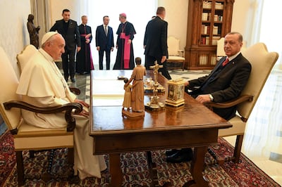 Turkish President Recep Tayyip Erdogan, right, and Pope Francis sit to talk as they meet at the Vatican, Monday, Feb. 5, 2018. Erdogan is the first Turkish president to visit the Vatican in nearly six decades. Francis met with him during his 2014 trip to Istanbul. (Alessandro Di Meo/Pool photo via AP)