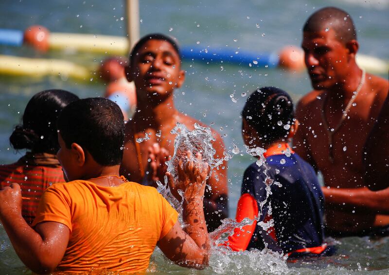 Visually impaired children enjoy the water. Reuters