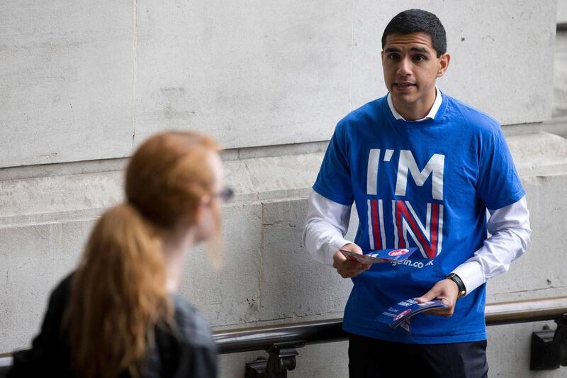 A campaigner hands out leaflets stating the official Remain case. Justin Tallis / AFP

