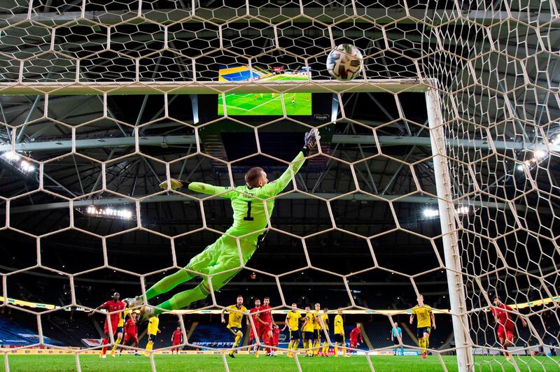 Swedish goalkeeper Robin Olsen is beaten by a Cristiano Ronaldo free-kick as the attacker scored his 100th goal for Portugal in the Uefa Nations League game  in Solna, Sweden, on Tuesday, September 8. AFP