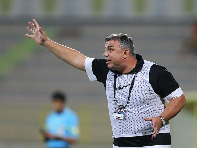 Al Ahli coach Cosmin Olaroiu cannot escape the grasp of his former club, Al Ain. Ashraf Al Amra / Al Ittihad