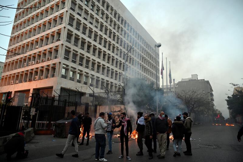 Anti-government protesters burn tyres and rubbish bins to block the road during a rally against the power cuts, the high cost of living and the low purchasing power of the Lebanese pound, in front of Lebanese Central Bank at Hamra street in Beirut. EPA