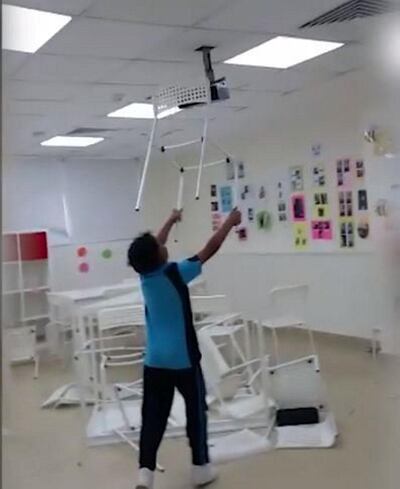 A video released by the Ministry of Education earlier this year showed pupils throwing chairs, tables and electronic devices across a classroom, behaviour that it condemned. Courtesy: Ministry of Education