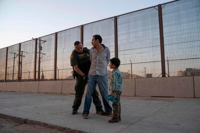 AFP presents a retrospective photo package of 60 pictures marking the 4-year presidency of President Trump.

José, 27, with his son José Daniel, 6, is searched by US Customs and Border Protection Agent Frank Pino, May 16, 2019, in El Paso, Texas. Father and son spent a month trekking across Mexico from Guatemala. 
 About 1,100 migrants from Central America and other countries are crossing into the El Paso border sector each day. US Customs and Border Protection Public Information Officer Frank Pino, says that Border Patrol resources and personnel are being stretched by the ongoing migrant crisis, and that the real targets of the Border Patrol are slipping through the cracks. - 
 / AFP / Paul Ratje
