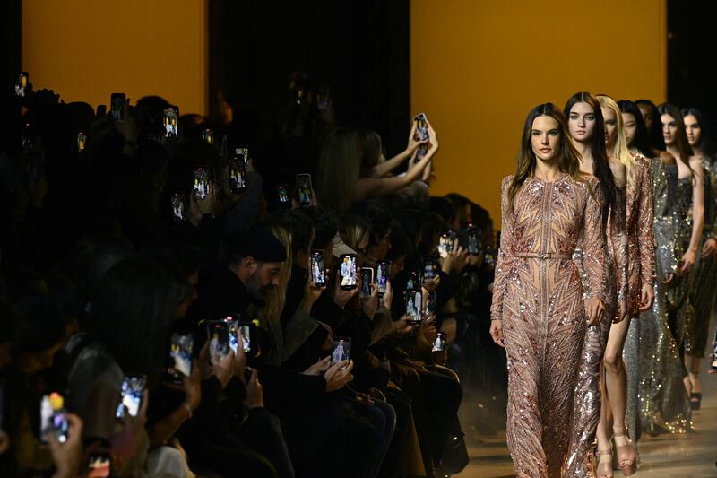 Brazilian model Alessandra Ambrosio presents a creation by Elie Saab for a Women Ready 2024/25 collection at Paris Fashion Week. AFP