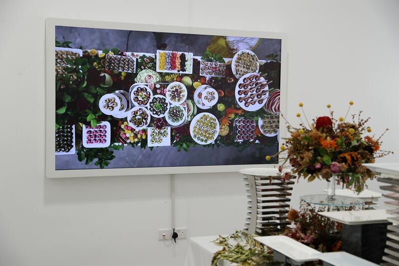 A photograph showing the dining table installation at the exhibition's opening