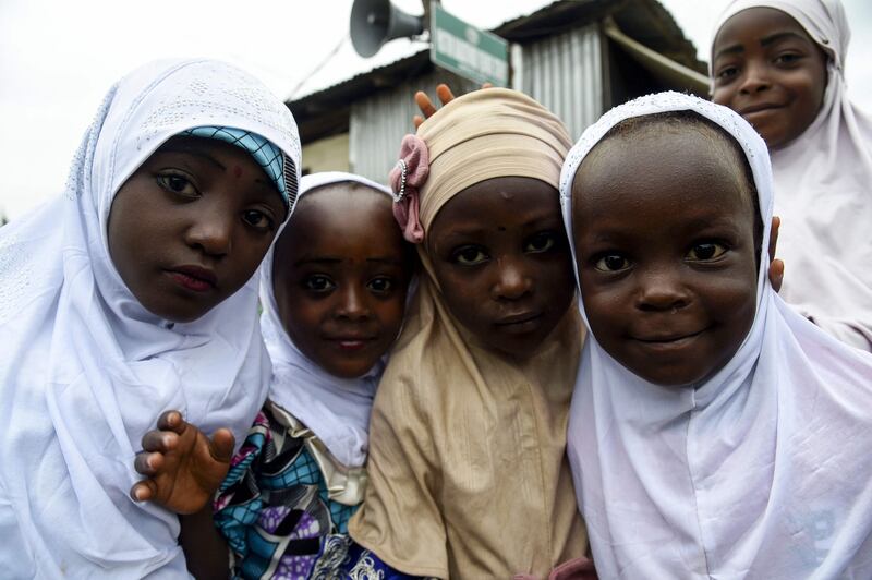 Young girls pose for pictures while celebrating Eid Al Adha at Ibafo Mosque in Ogun state, south-west Nigeria.