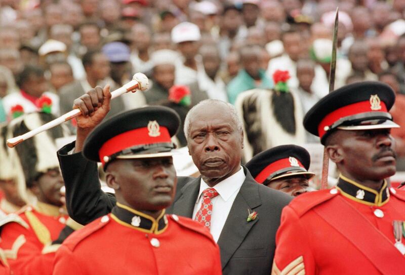 (FILES) In this file photo taken on January 05, 1998 Kenyan President Daniel arap Moi (C) greets his supporters after he was sworn in for final five-year term in Nairobi.  Daniel arap Moi, a former schoolteacher who became Kenya's longest-serving president and presided over years of repression and economic turmoil fueled by runaway corruption, has died. Moi's death was announced by President Uhuru Kenya in a statement on the state broadcaster on February 4, 2020. He was 95. / AFP / ALEXANDER JOE

