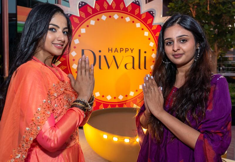 Visitors to the India pavilion prepare for the festival of lights. Victor Besa / The National