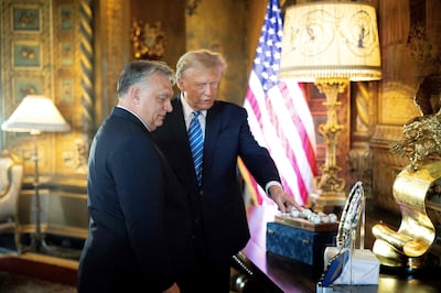 Hungarian Prime Minister Viktor Orban, left, and former US president and Republican presidential candidate Donald Trump at his Mar-a-Lago residence in Palm Beach, Florida. Hungarian Prime Minister's Office / AFP
