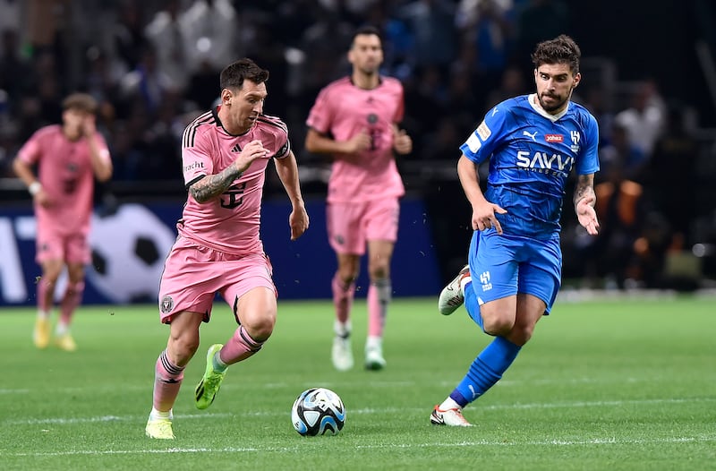 Lionel Messi, left, of Inter Miami in action against Ruben Neves of Al Hilal during the Riyadh Season Cup 2024 match at the Kingdom Arena in Riyadh, Saudi Arabia on January 29, 2024. EPA